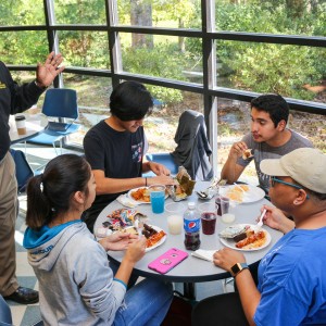 Man talking to a table of students