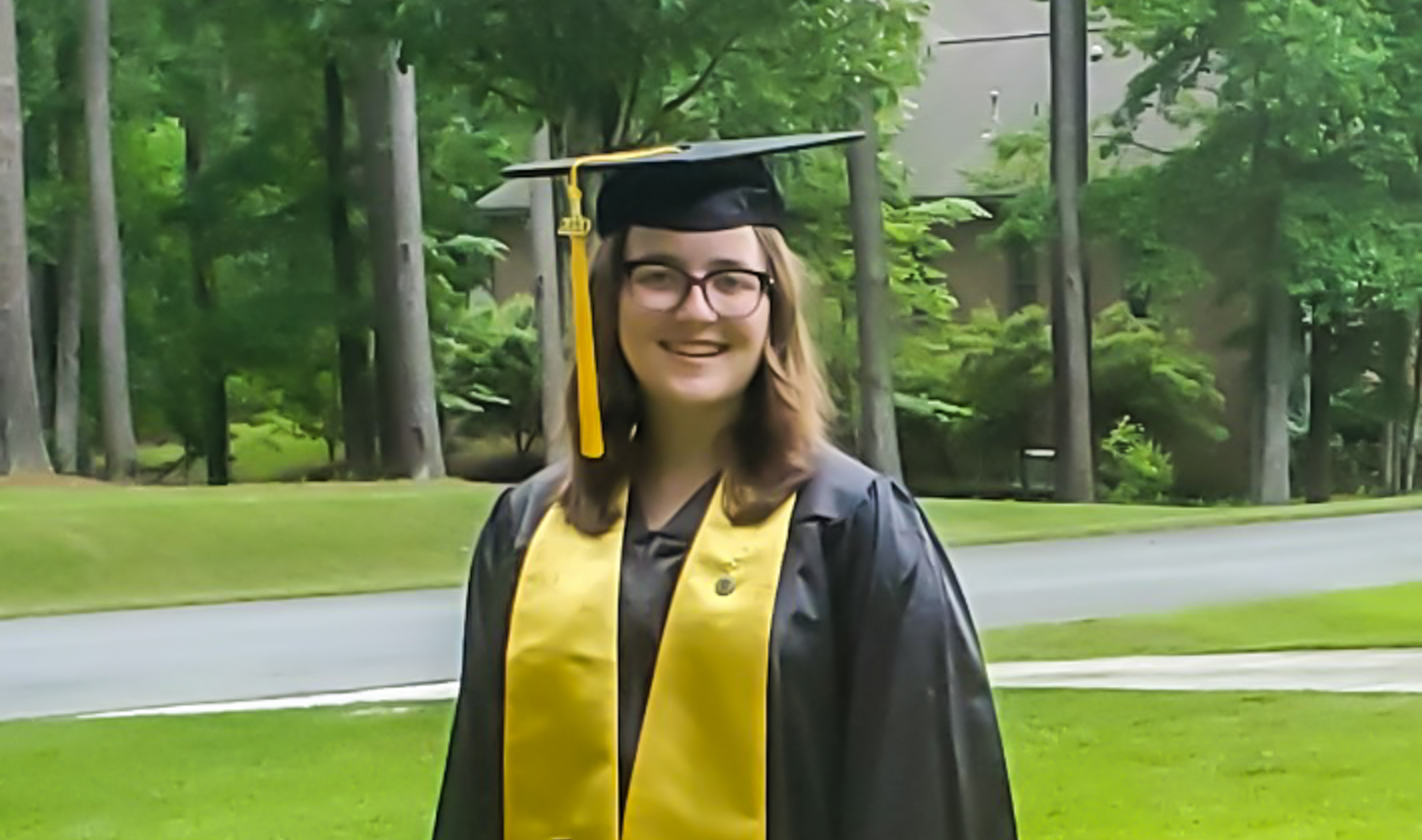 a student in a cap and gown