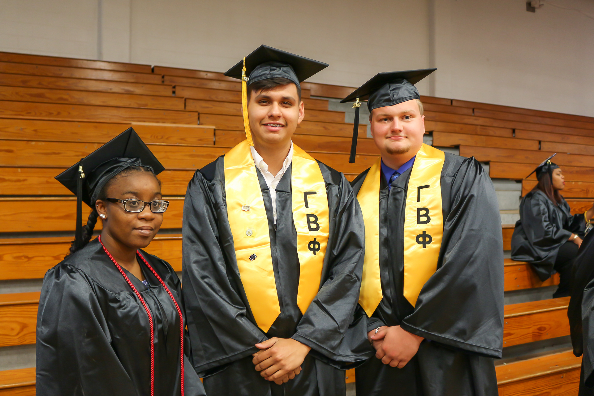 Three students at graduation
