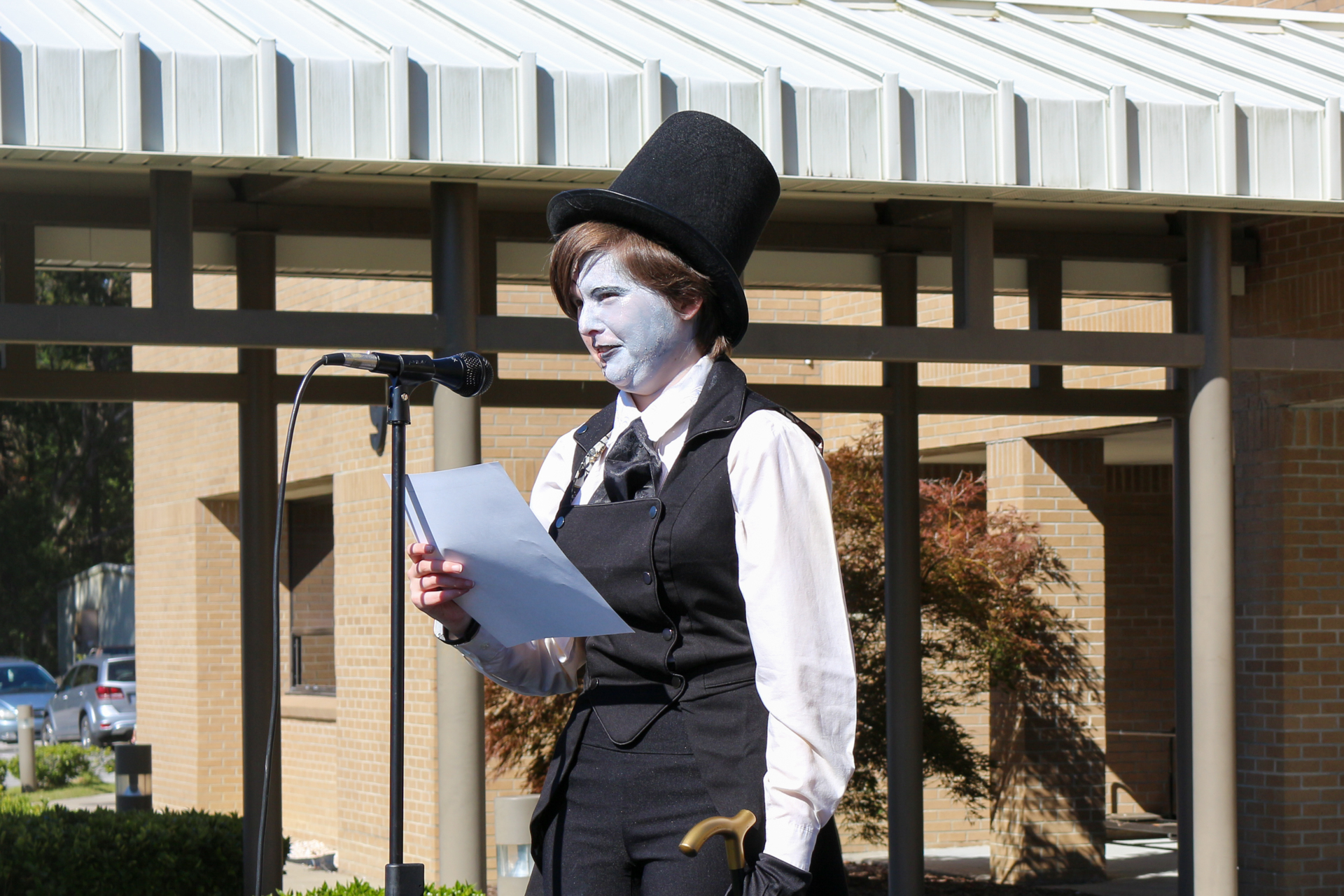a person in costume at a microphone