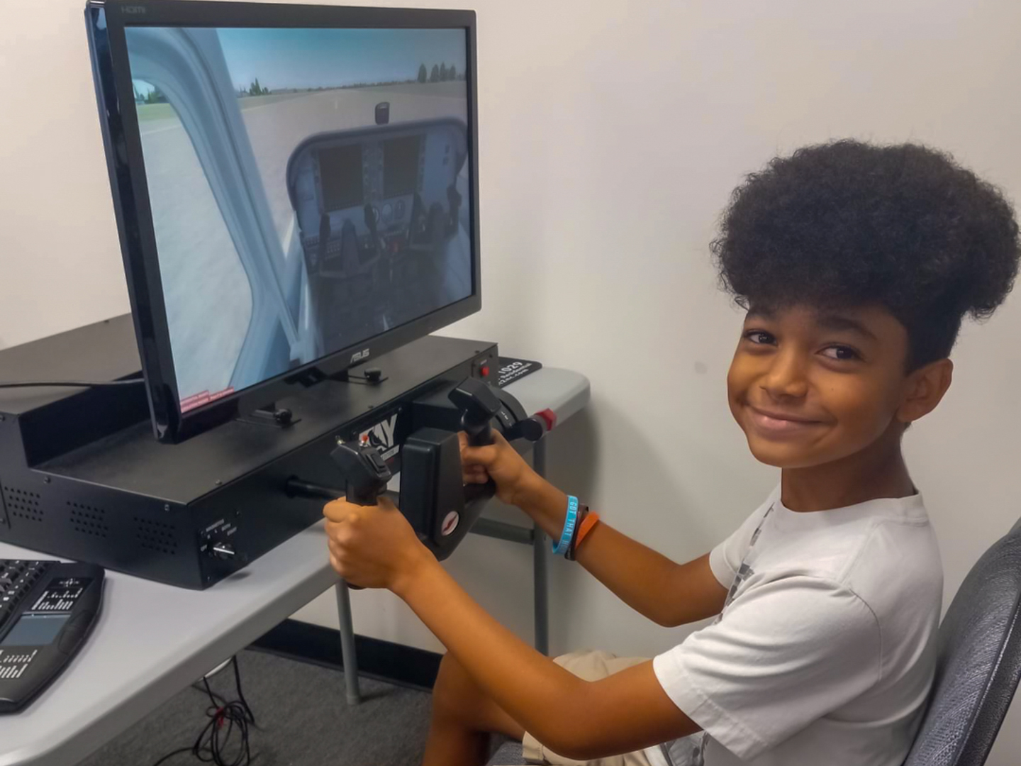 a child using a flight simulator